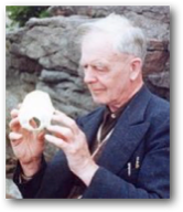 William Sutherland holding a bone.